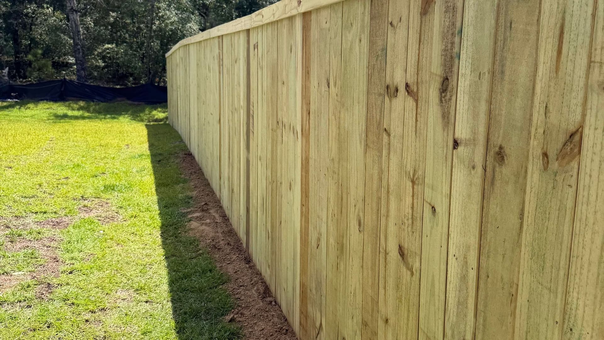 Completed wood privacy fence run by Walter Handyman LLC
